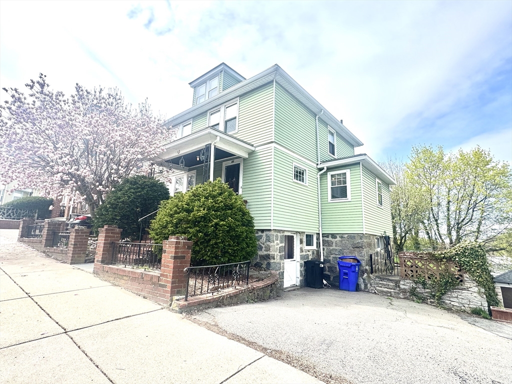 53 Breck Avenue Boston, MA 02135 - Photo 2 of 35 a view of a house with a patio