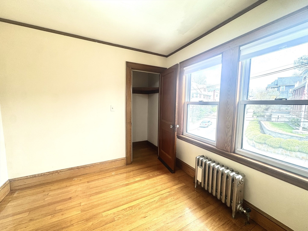53 Breck Avenue Boston, MA 02135 - Photo 22 of 35 a view of an empty room and window