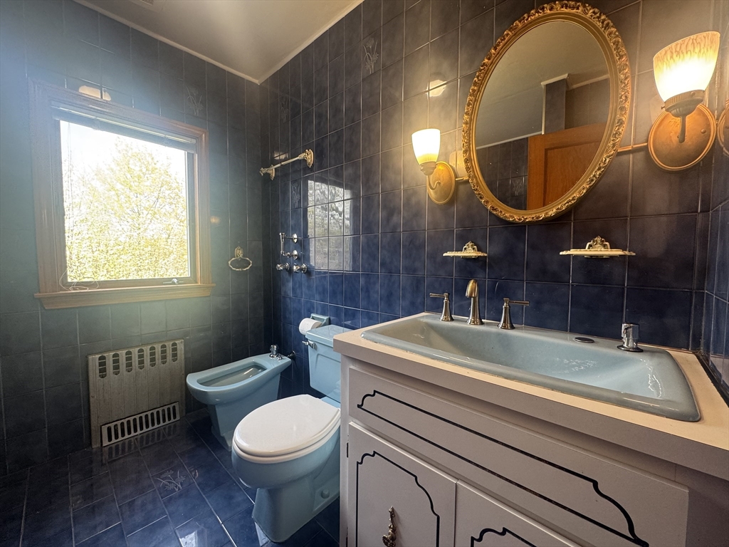 53 Breck Avenue Boston, MA 02135 - Photo 25 of 35 a bathroom with a sink and a mirror