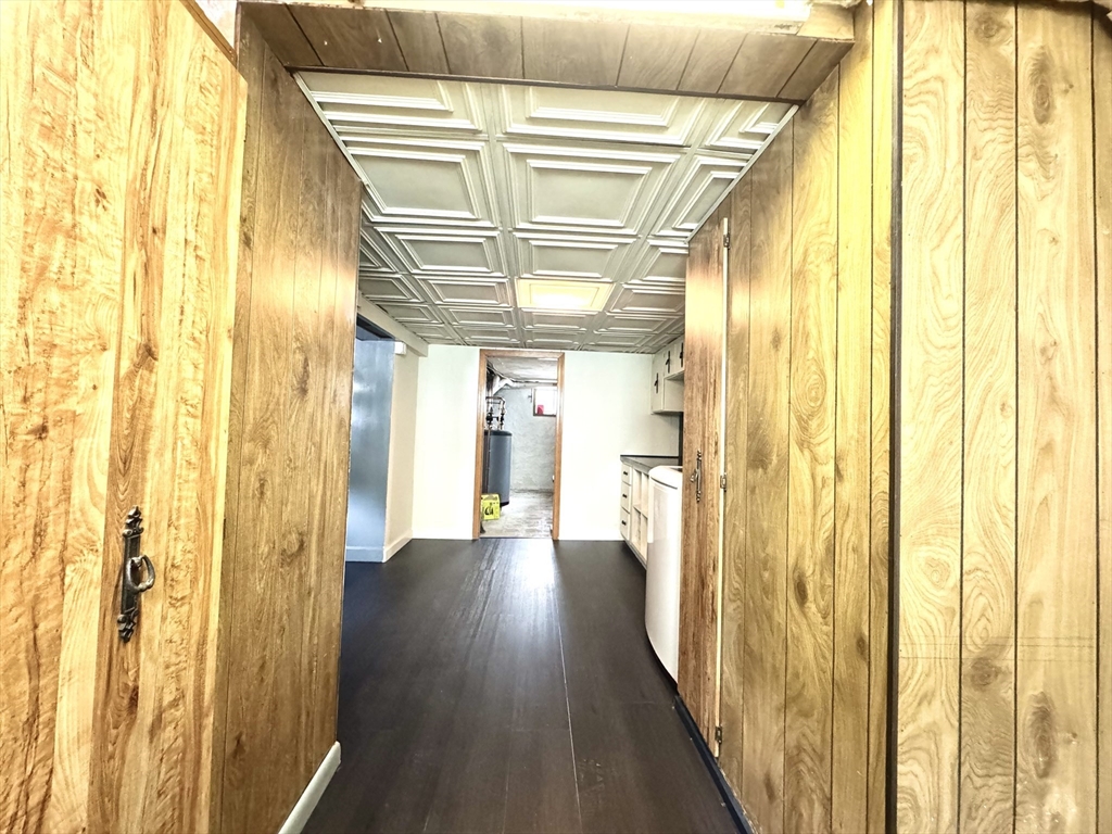 53 Breck Avenue Boston, MA 02135 - Photo 30 of 35 a view of a hallway with wooden floor and door
