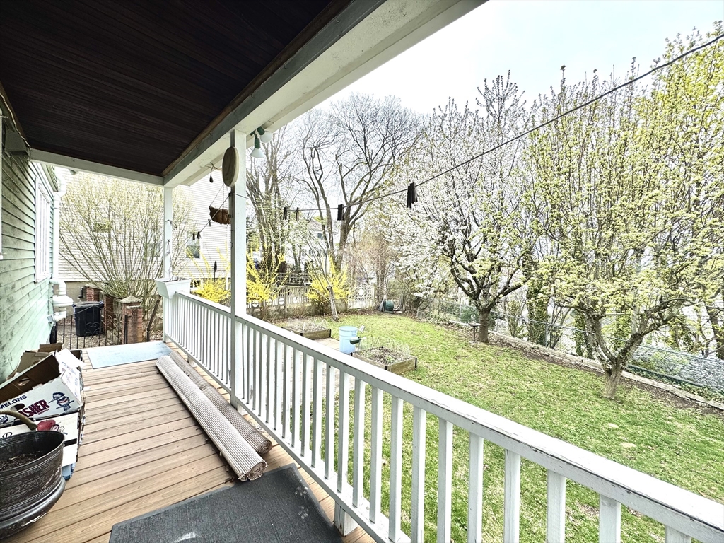 53 Breck Avenue Boston, MA 02135 - Photo 31 of 35 a view of a porch with wooden floor and fence