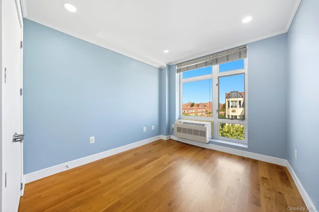 a view of room with window and hardwood floor