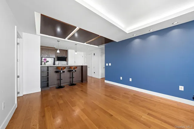 a kitchen with stainless steel appliances a refrigerator and a microwave