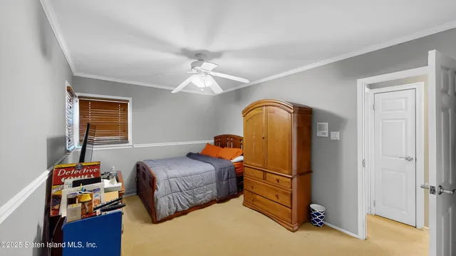 a bedroom with bed and window