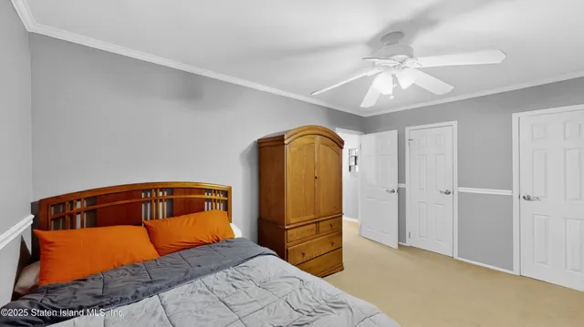 a bedroom with a bed and cabinets