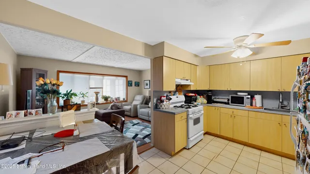 a view of a kitchen and dining room