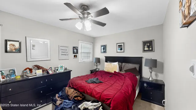 a bed room with a bed and a chandelier