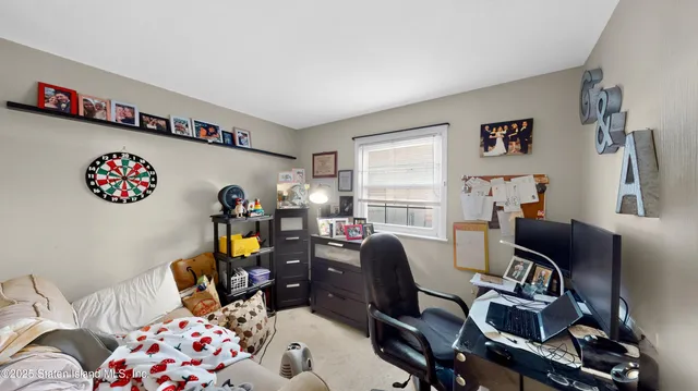 a bedroom with furniture and a window