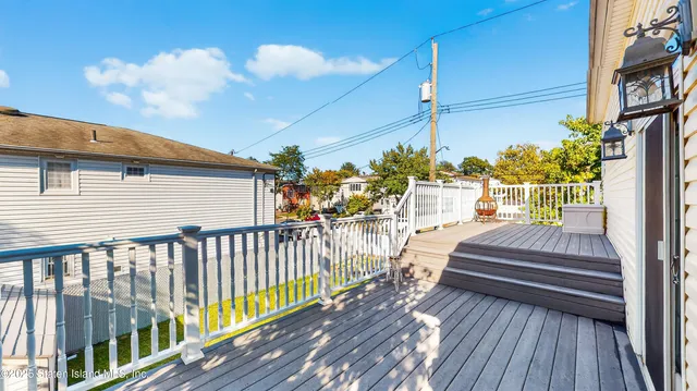 a view of a balcony with wooden floor