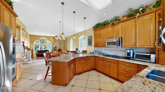 a large kitchen with lots of counter space and windows