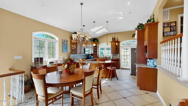 a view of a a dining room with furniture window and outside view
