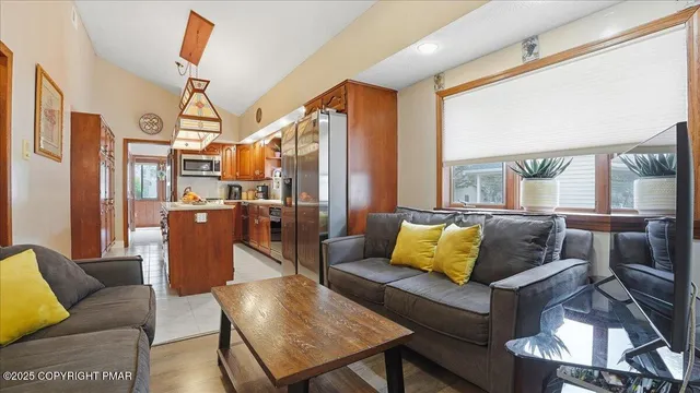 a kitchen with a refrigerator stove and white cabinets
