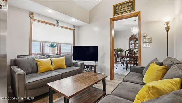 a kitchen with a refrigerator and dining table