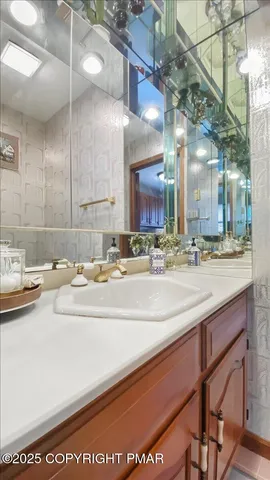 an aerial view of multiple houses with a big yard