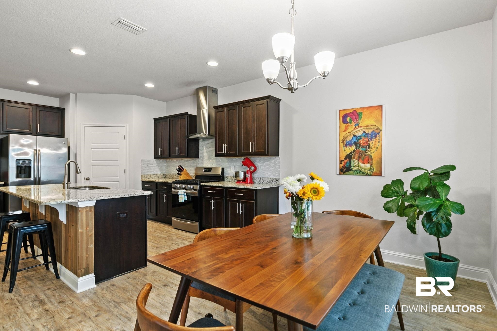 31350 Hoot Owl Road Daphne, AL 36527 - Photo 22 of 94 Dining room featuring light wood-style floors and hanging lights