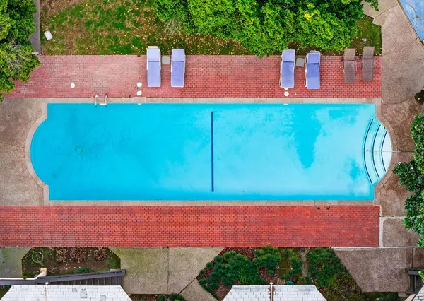 a view of house with a yard