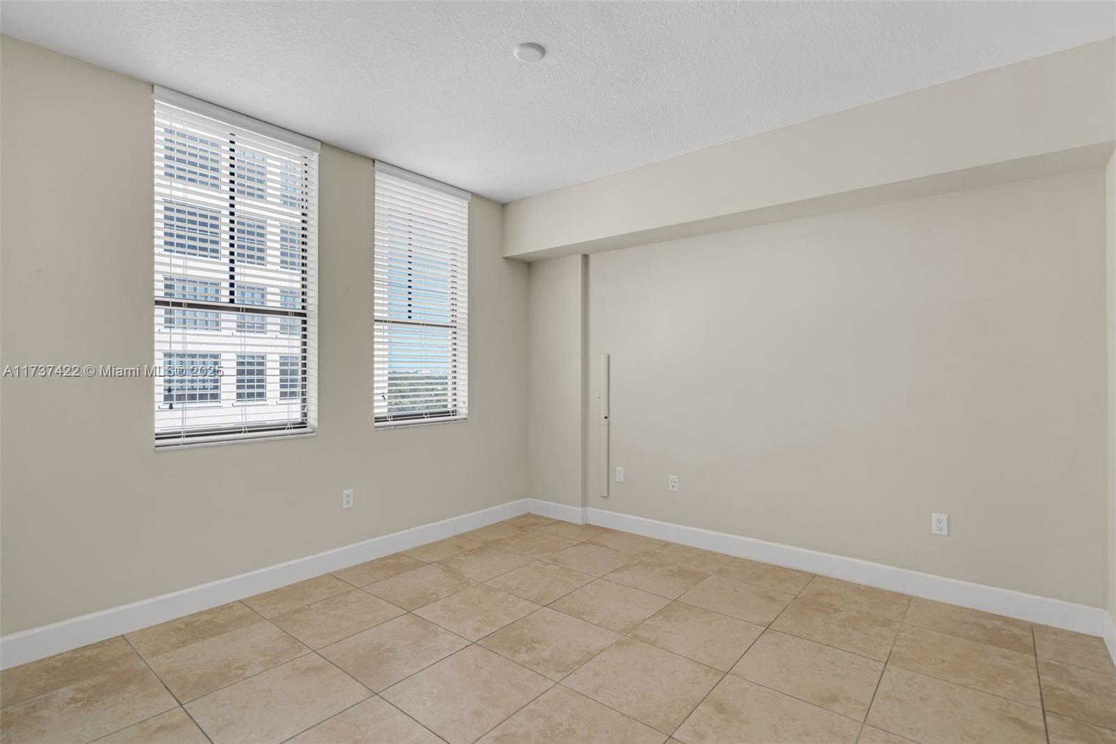 55 Merrick Way, Unit 624 Coral Gables, FL 33134 - Photo 11 of 41 a view of an empty room with a window