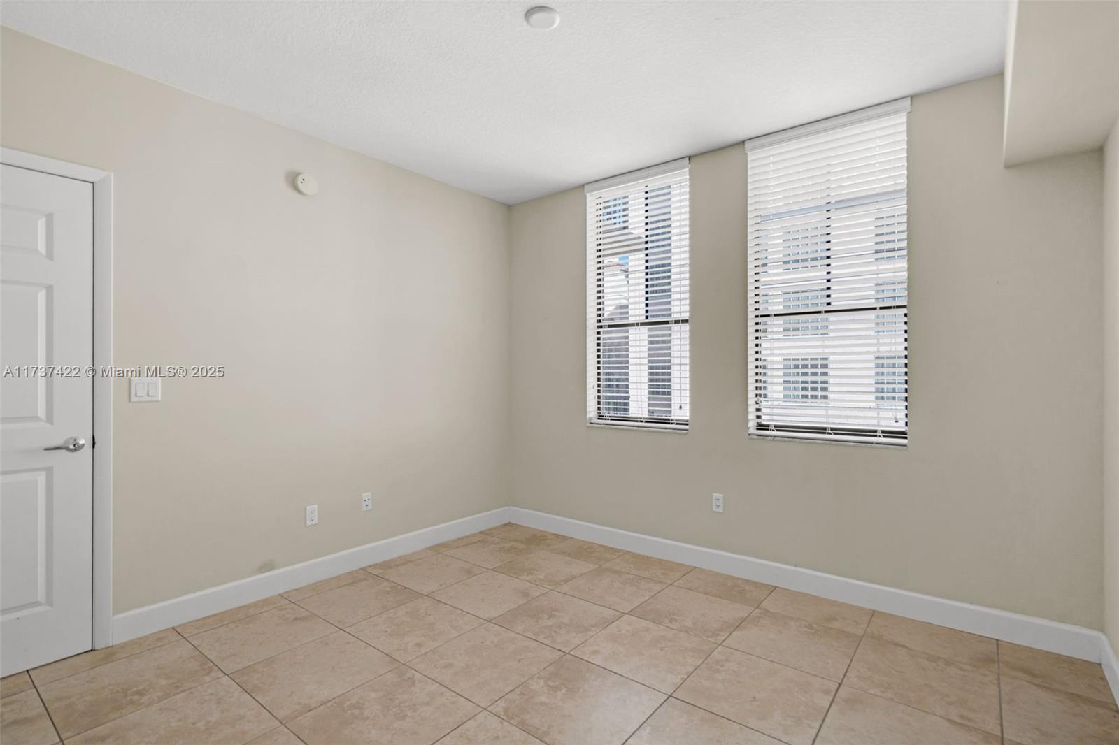 55 Merrick Way, Unit 624 Coral Gables, FL 33134 - Photo 13 of 41 a view of an empty room with a window