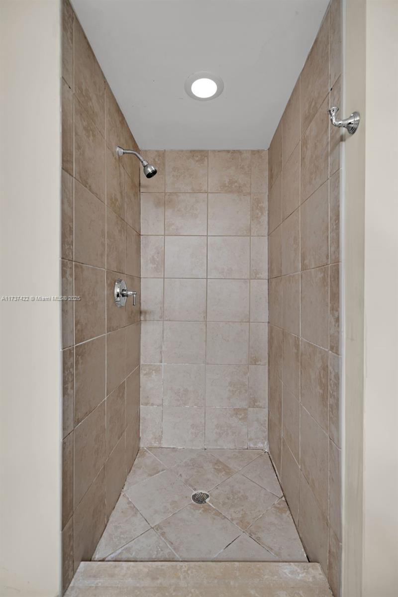 55 Merrick Way, Unit 624 Coral Gables, FL 33134 - Photo 14 of 41 a bathroom with a shower