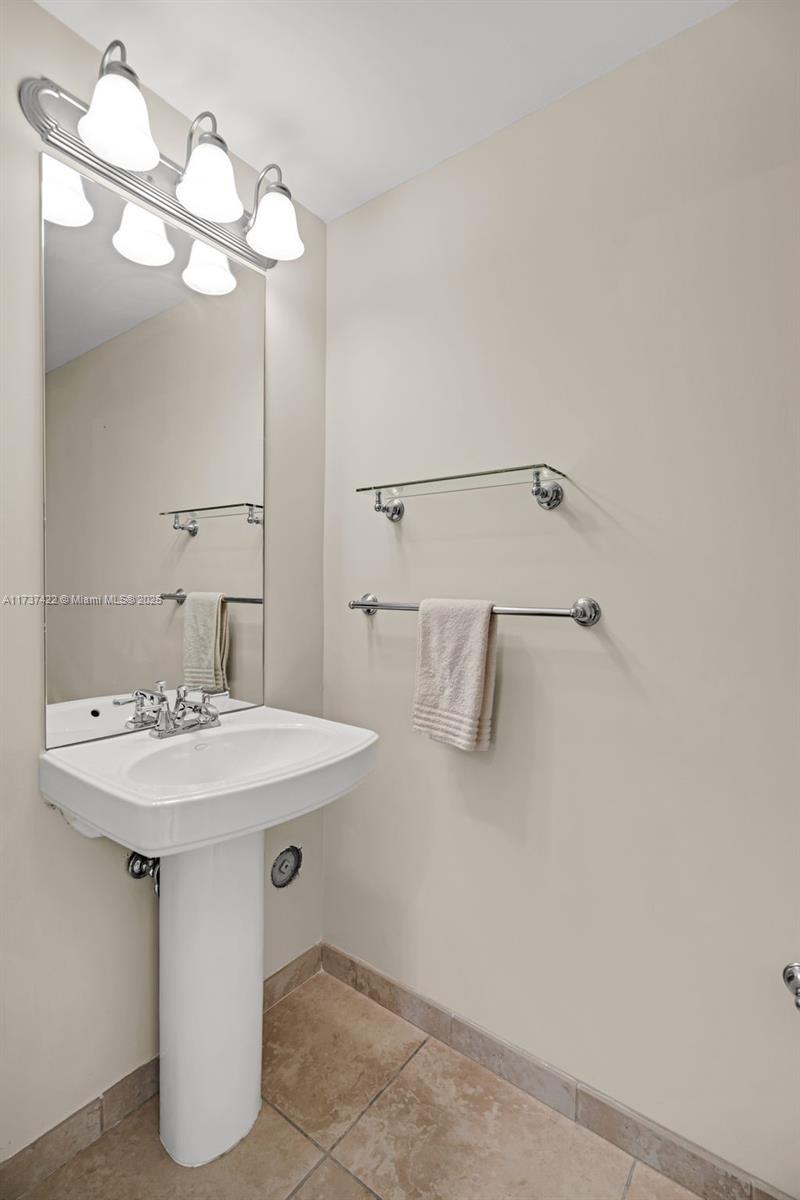 55 Merrick Way, Unit 624 Coral Gables, FL 33134 - Photo 17 of 41 a bathroom with a sink and a mirror