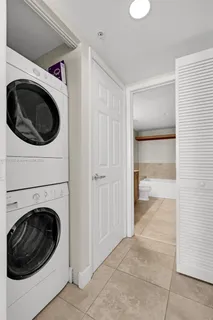 a view of a hallway with washer and dryer