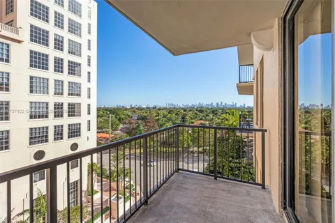 a view of a balcony with a floor to ceiling window
