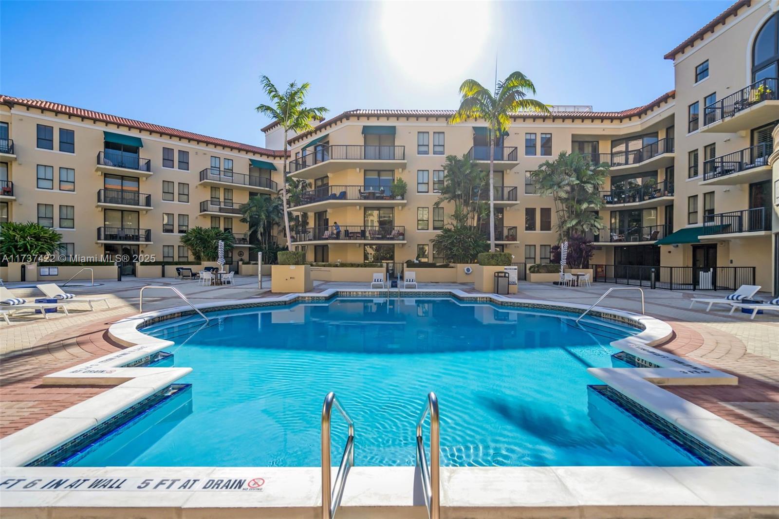 55 Merrick Way, Unit 624 Coral Gables, FL 33134 - Photo 2 of 41 a swimming pool view with a outdoor seating