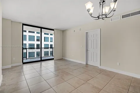 a view of empty room with a large window
