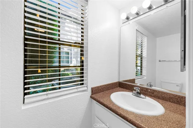 a balcony with furniture and a potted plant