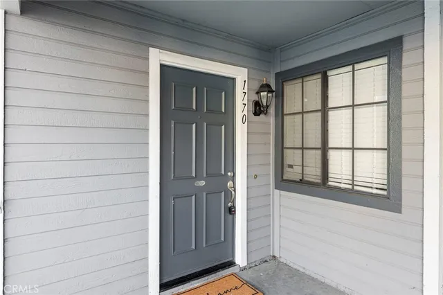 front view of a brick house with a large window