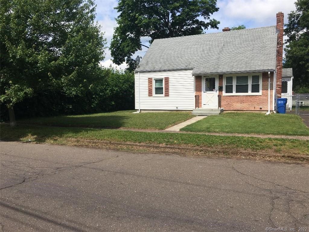 40 Twin Brook Road Hamden, CT 06514 - Photo 1 of 1 a front view of a house with a garden and trees