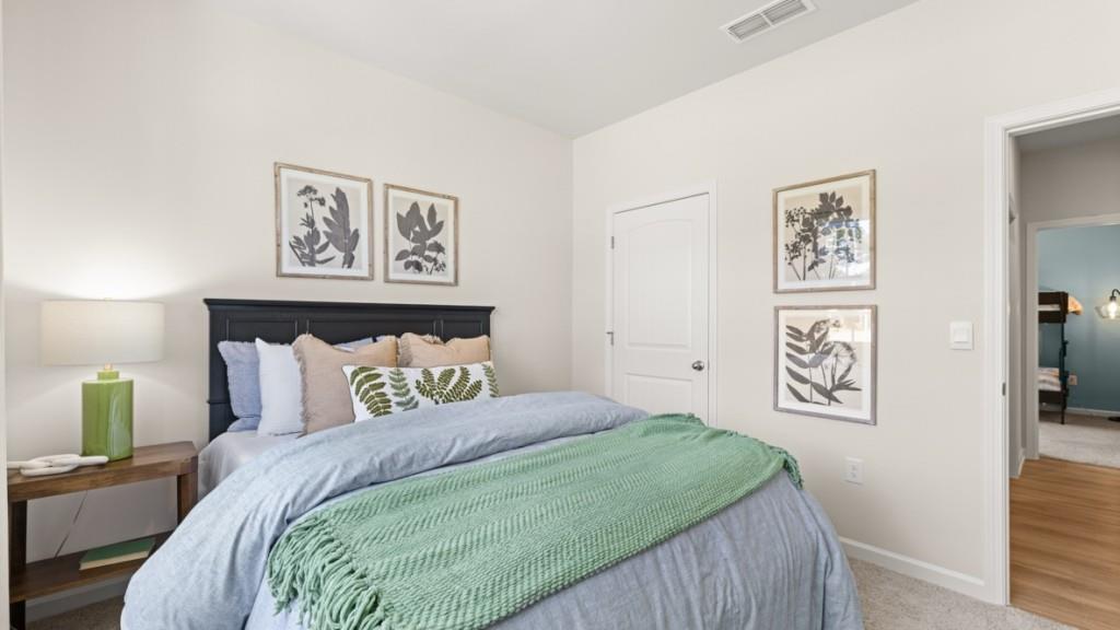 99 Babcock Drive Northeast Rome, GA 30165 - Photo 22 of 33 a bedroom with a bed and painting on the wall