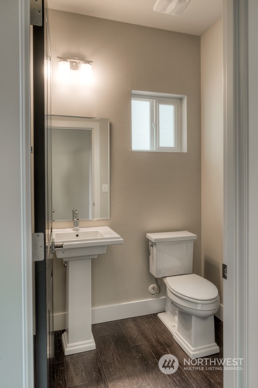13 178th Place Southwest Bothell, WA 98012 - Photo 12 of 26 a white toilet sitting next to a bathroom sink