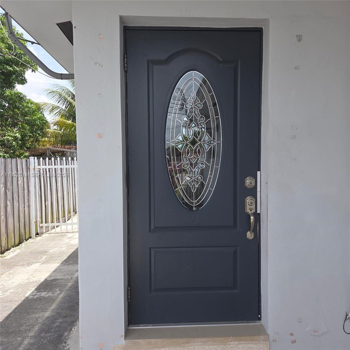 a view of door with wooden walls