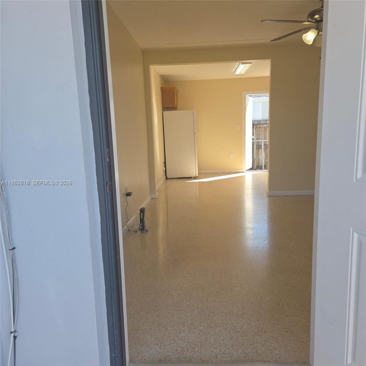 7401 Southwest 21st Street Miami, FL 33155 - Photo 20 of 31 an empty room with wooden floor and mirror