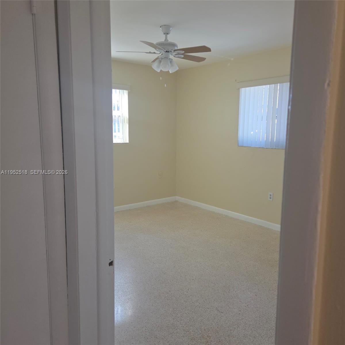 7401 Southwest 21st Street Miami, FL 33155 - Photo 26 of 31 an empty room with a window and a fan