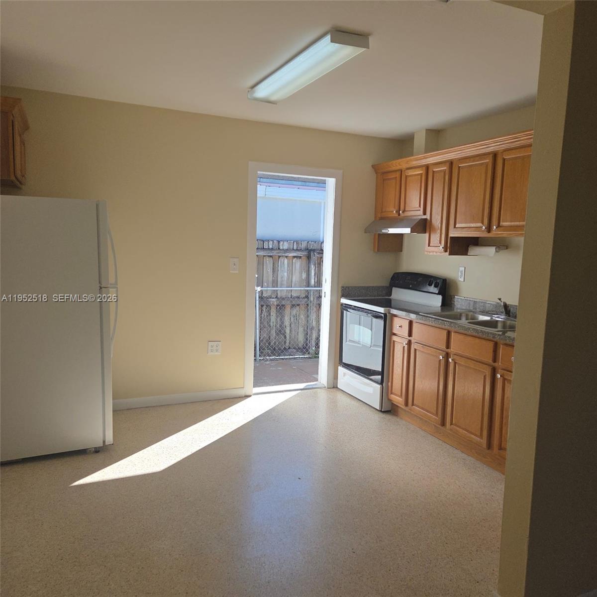 7401 Southwest 21st Street Miami, FL 33155 - Photo 29 of 31 a view of a kitchen with furniture and wooden floor