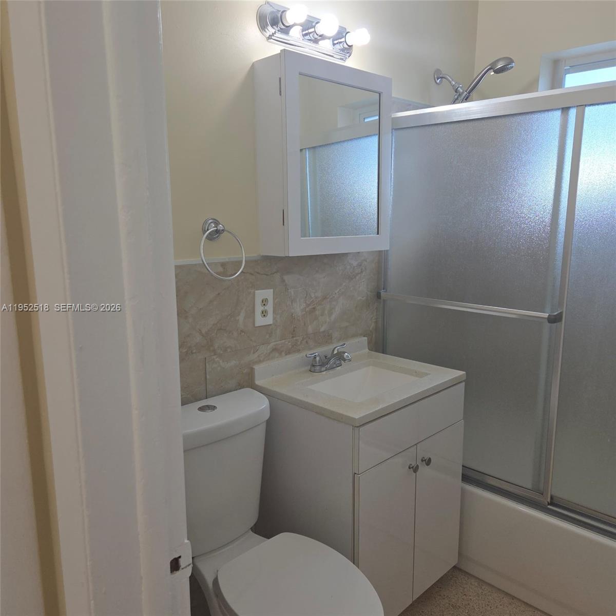 7401 Southwest 21st Street Miami, FL 33155 - Photo 31 of 31 a bathroom with a toilet sink and mirror