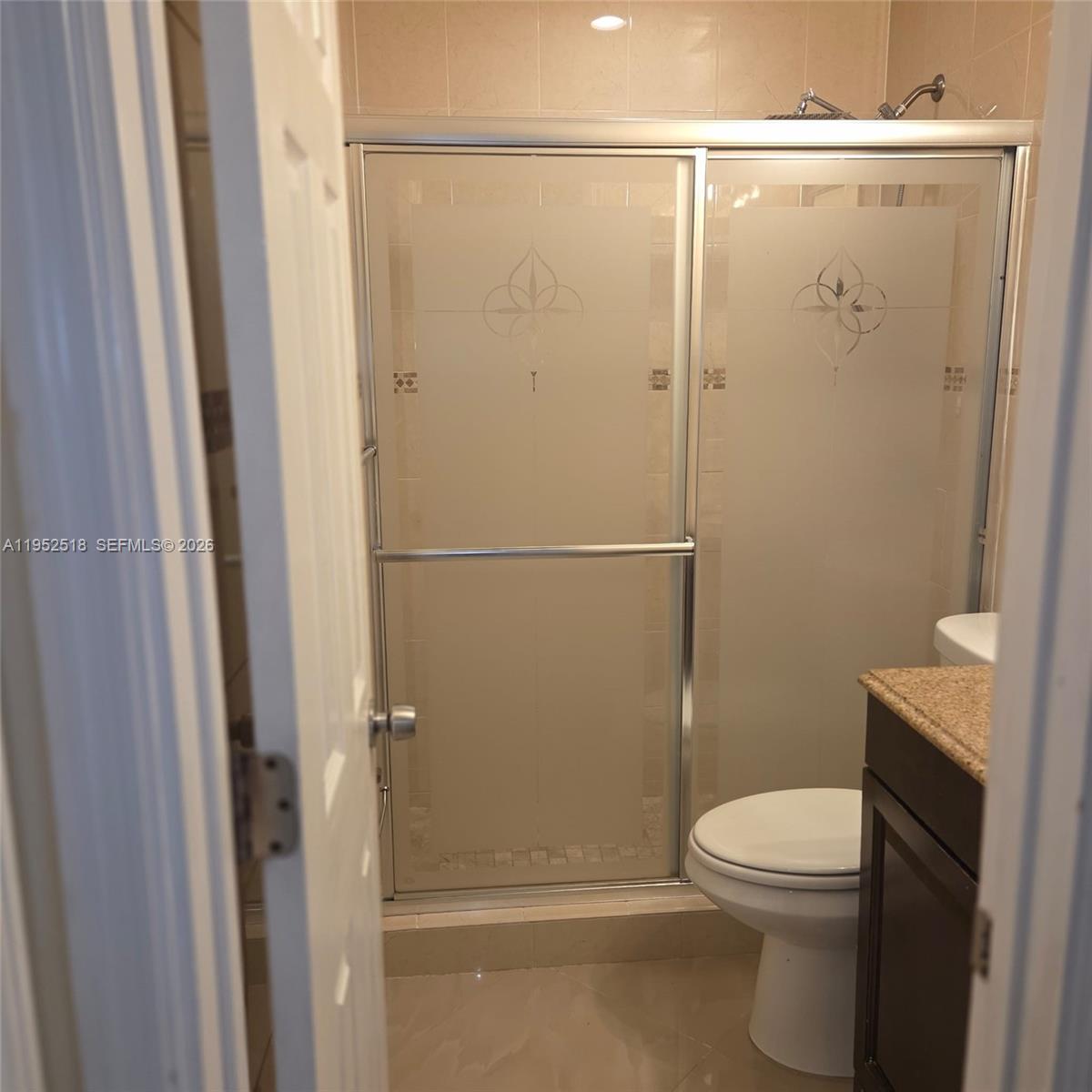 7401 Southwest 21st Street Miami, FL 33155 - Photo 10 of 31 a bathroom with a toilet and a shower