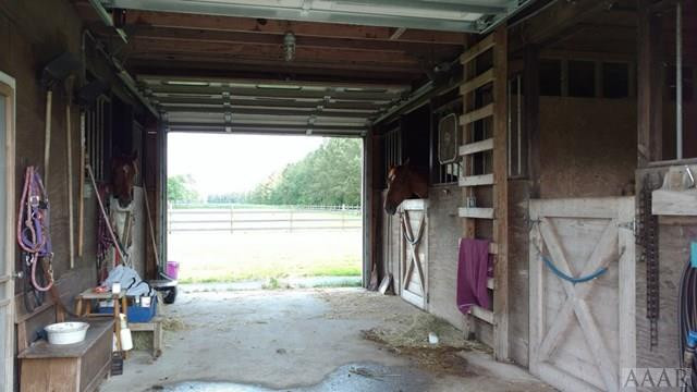 335 Puddin Ridge Road Moyock, NC 27958 - Photo 20 of 29 Main barn aisleway
