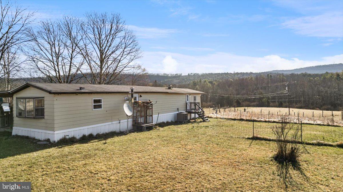 244 Muddy Road Augusta, WV 26704 - Photo 2 of 33 a view of a house with a yard and sitting area