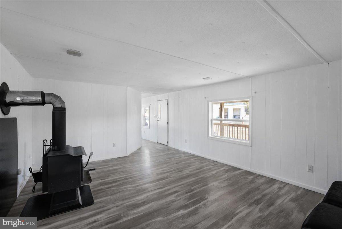 244 Muddy Road Augusta, WV 26704 - Photo 28 of 33 a view of empty room with windows and wooden floor