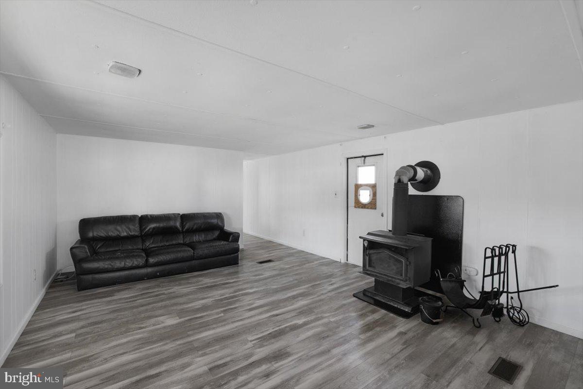 244 Muddy Road Augusta, WV 26704 - Photo 29 of 33 a living room with furniture and a wooden floor