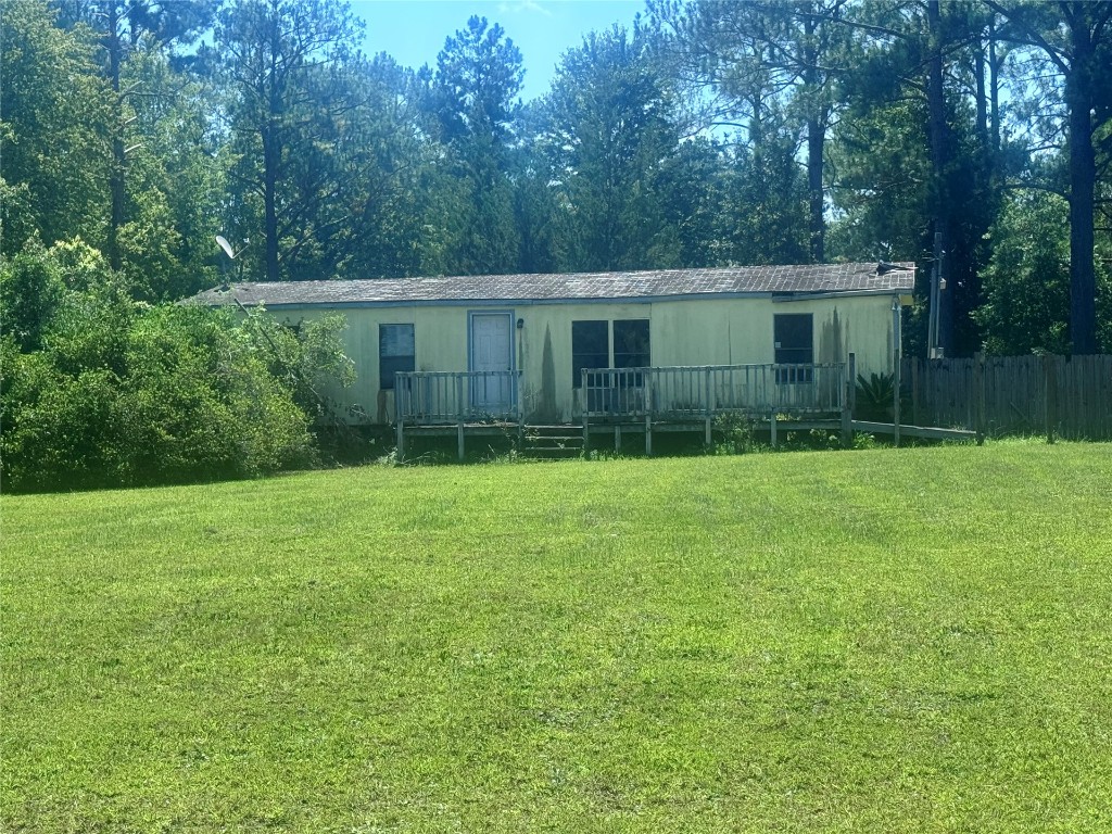 54440 Bea Road Callahan, FL 32011 - Photo 1 of 10 a view of a backyard with plants and large trees