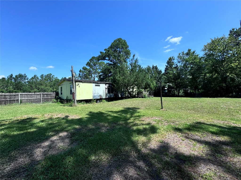 54440 Bea Road Callahan, FL 32011 - Photo 7 of 10 a backyard of a house with lots of green space