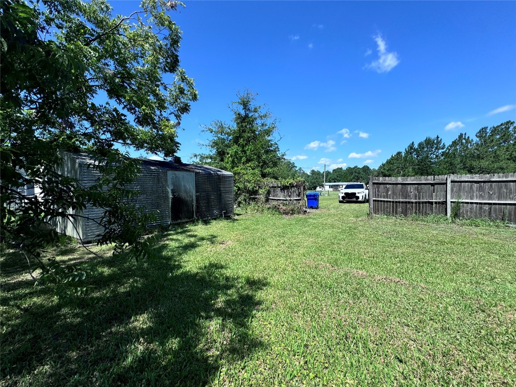54440 Bea Road Callahan, FL 32011 - Photo 8 of 10 a view of green field with wooden fence