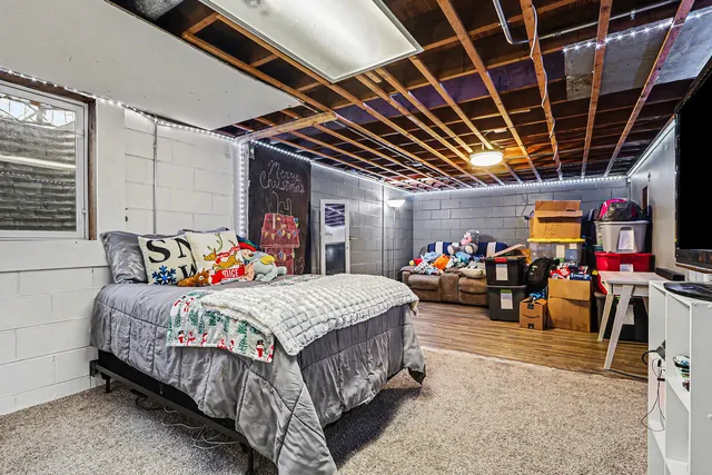 a bedroom with bed and a walk in closet