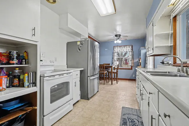 a kitchen with furniture a counter and a sink