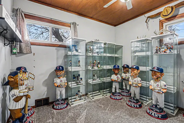 a room with gym equipment and a table