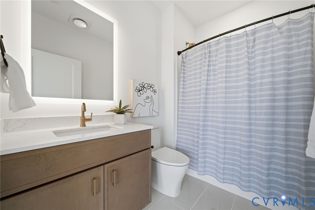 112 Manchester Road Richmond, VA 23224 - Photo 14 of 21 Contemporary bathroom featuring a wood-finish vani